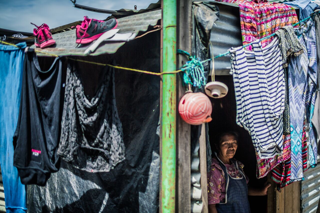 Guatemalan woman drying clothes